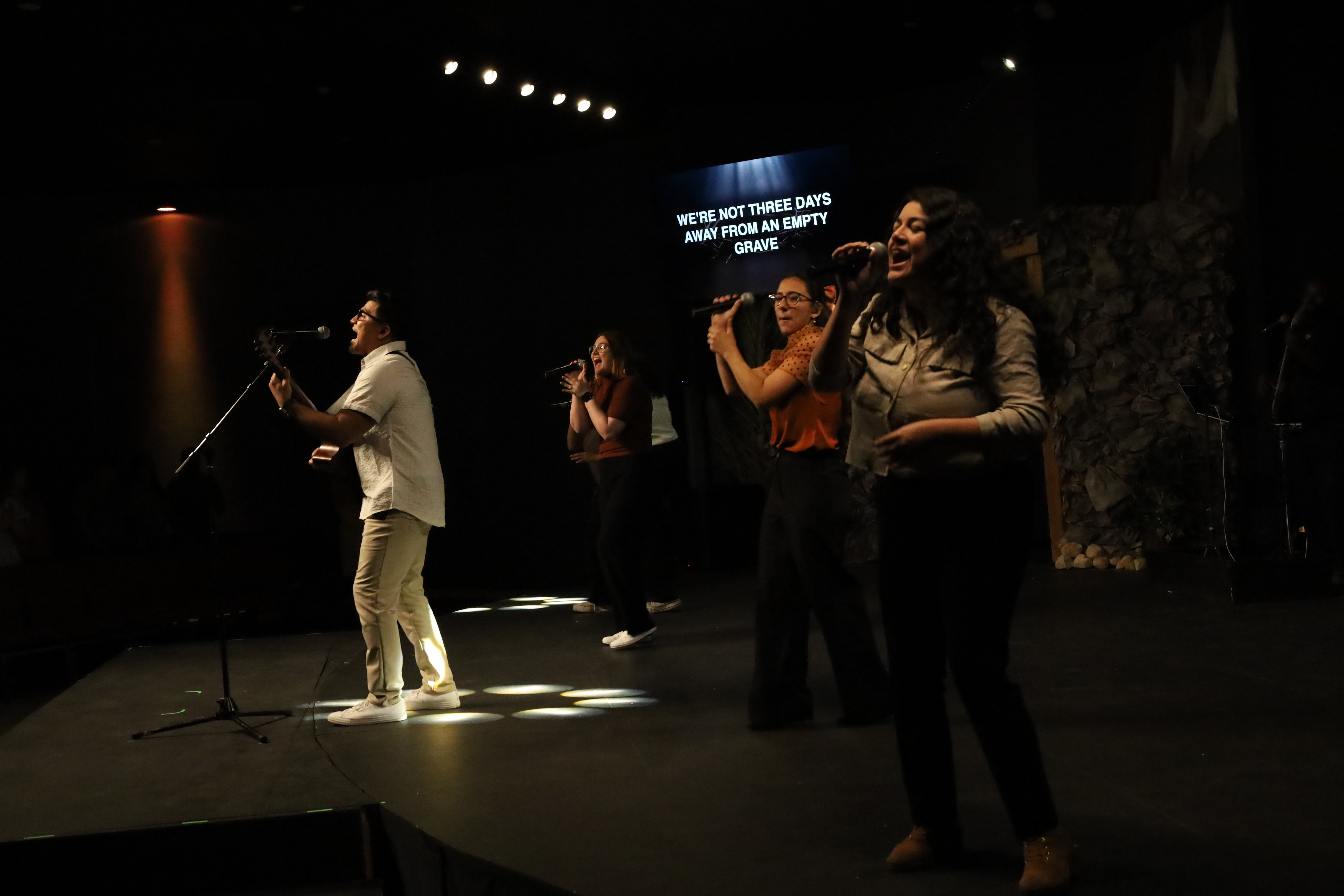 Worship team on stage with blue lights